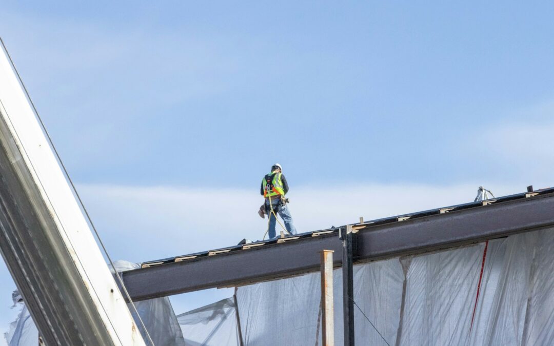 a man standing on top of a metal structure